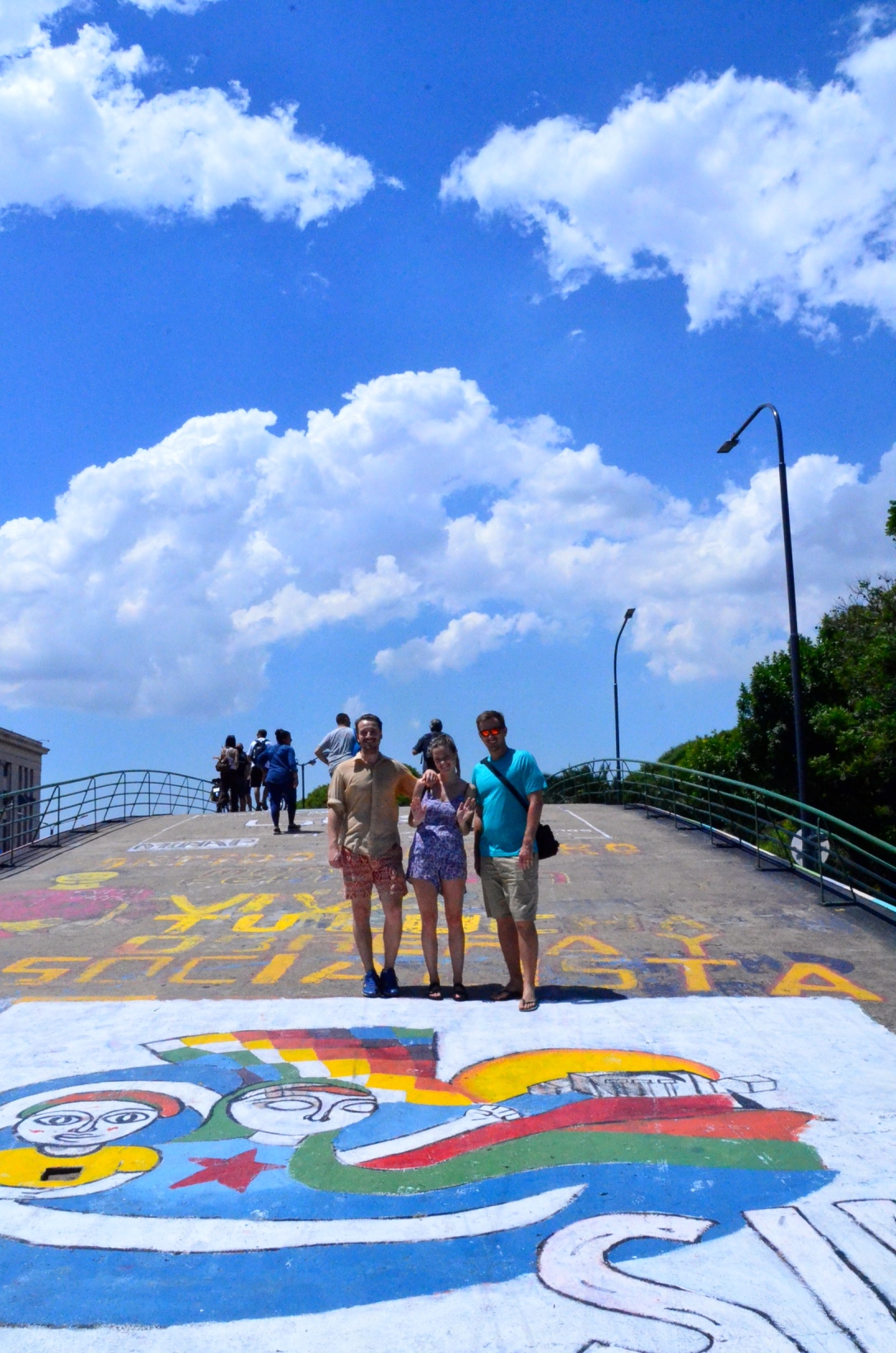 Grady, Elisa & Neil crossing a colourful bridge in BA 
